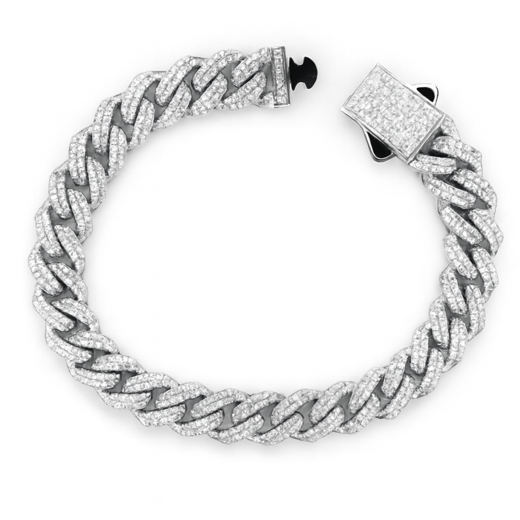 Silver chain bracelet with diamond-like stones on a white background
