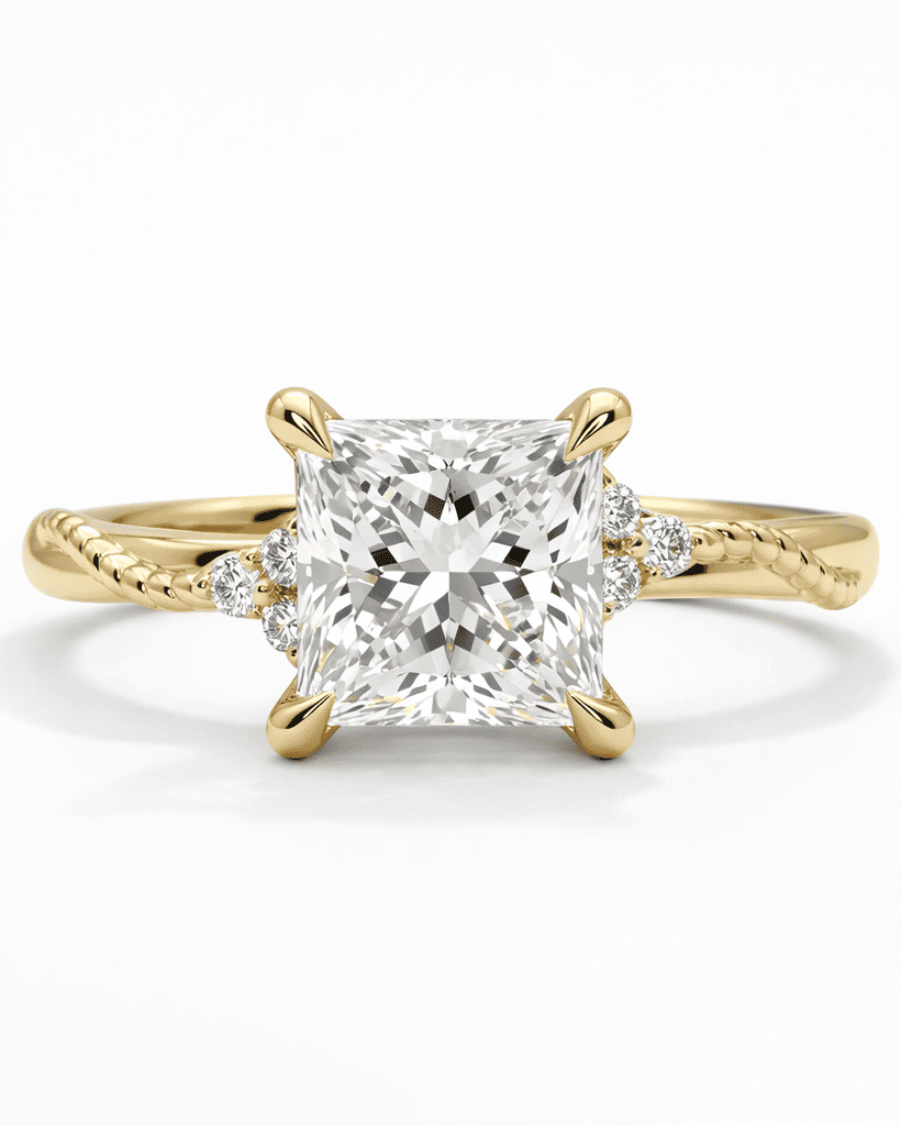 Gold ring with a large diamond and smaller diamonds on the band against a white background