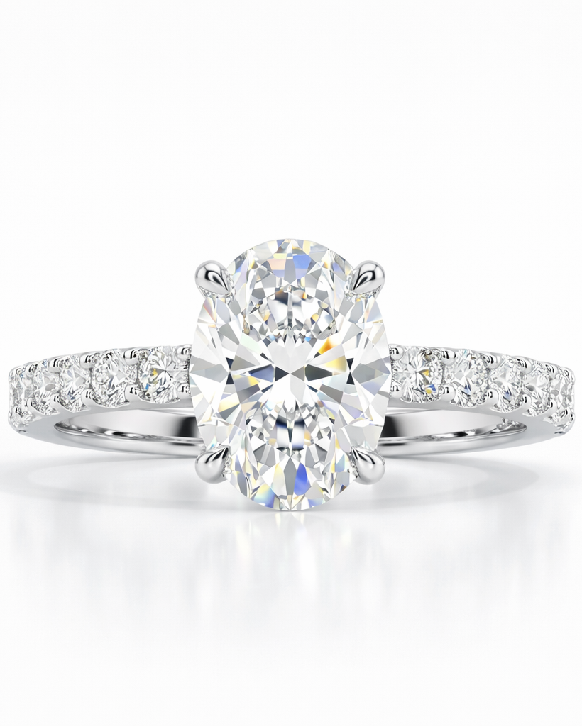 Diamond ring with a large central gemstone and smaller stones on a white background