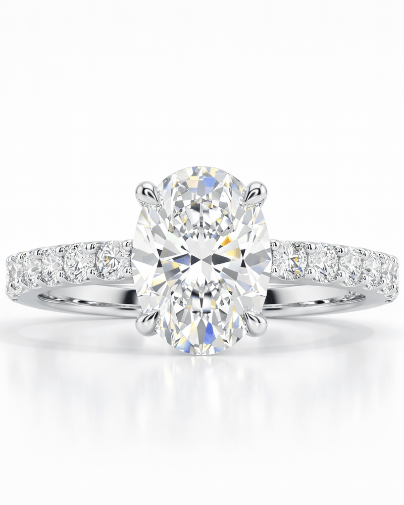 Diamond ring with a large central gemstone and smaller stones on a white background