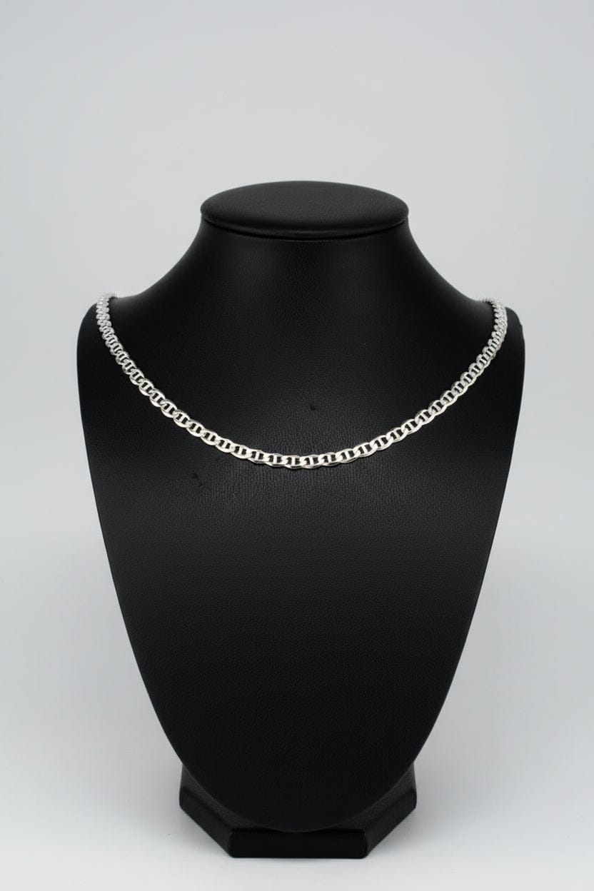 Silver chain necklace on a black background