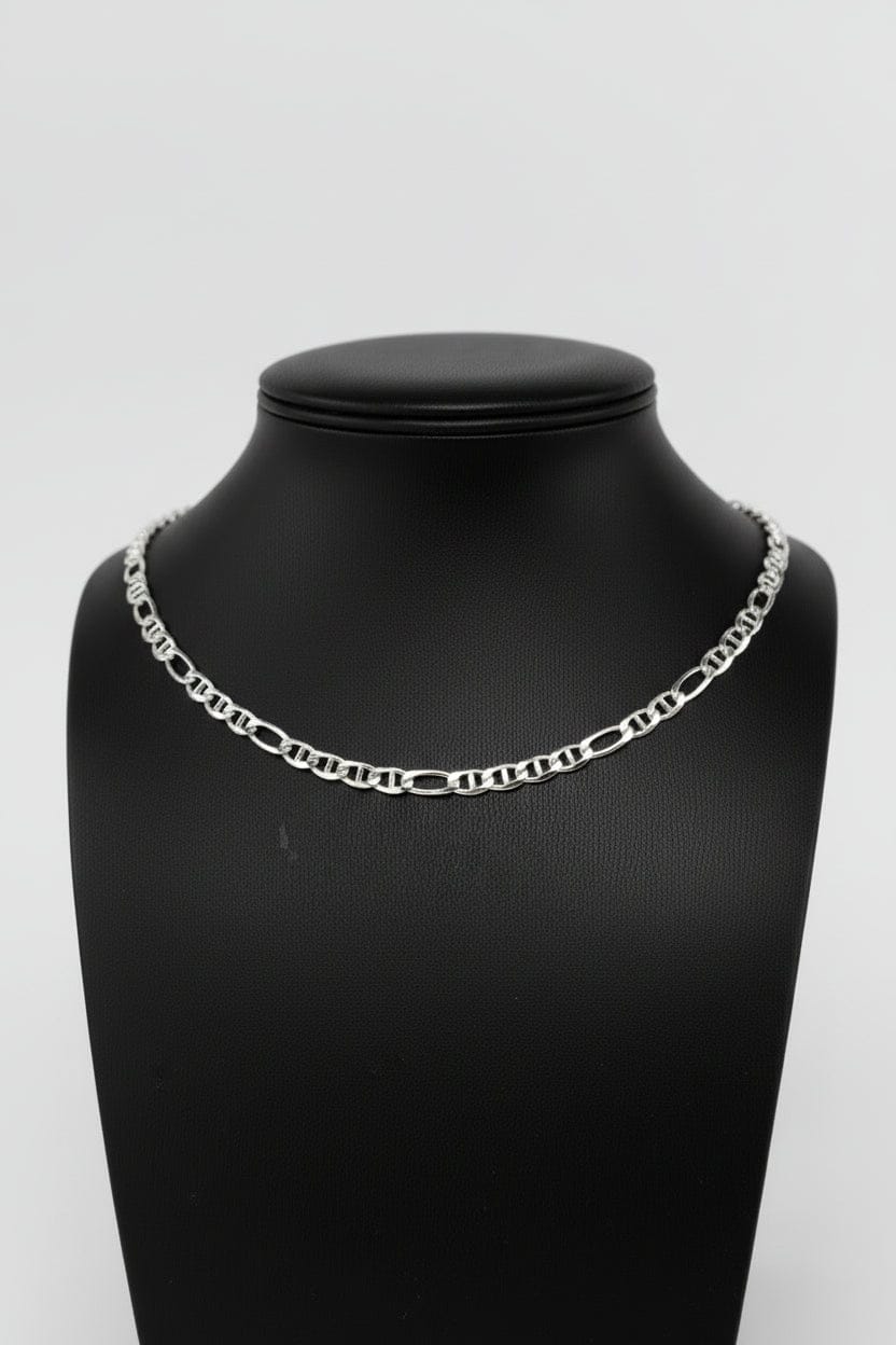 Silver chain necklace on a black mannequin bust