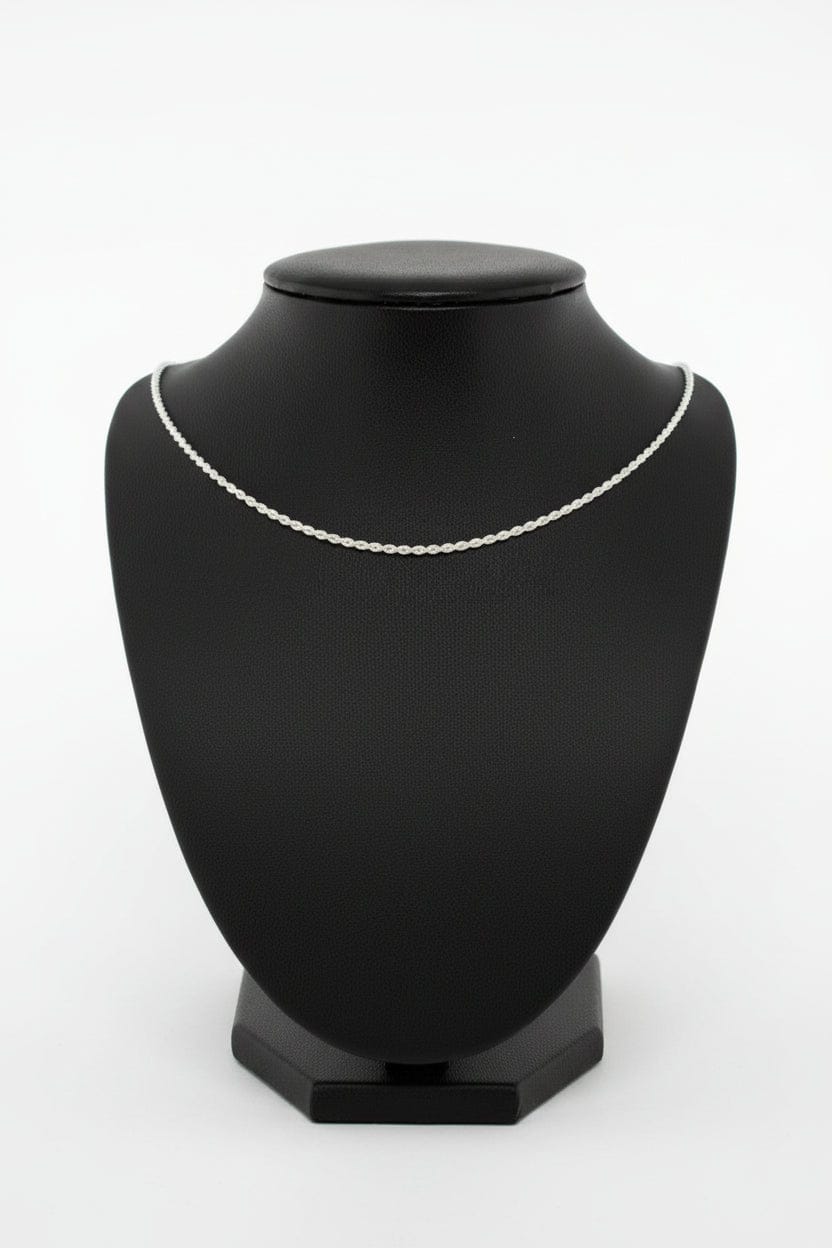 Silver necklace on a black mannequin bust