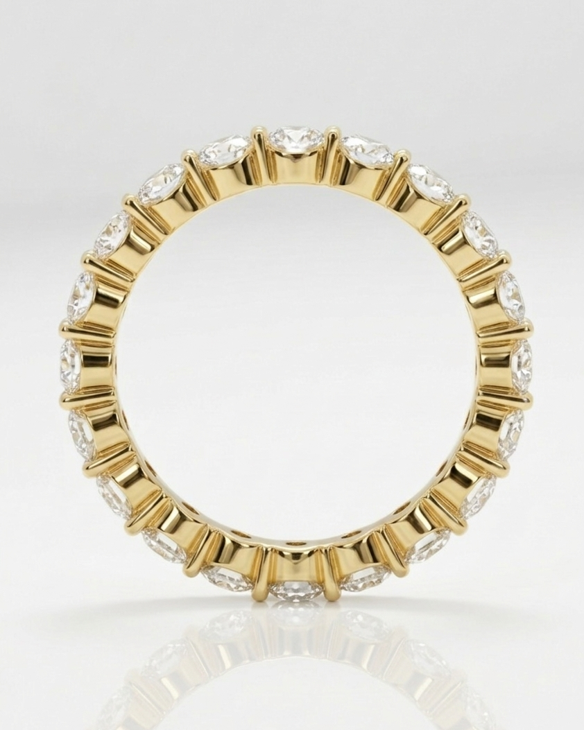 Gold ring with embedded diamonds on a white background