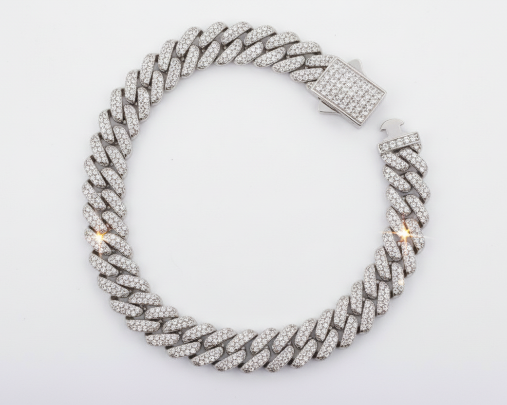 Silver braided necklace with clear stones on a white background