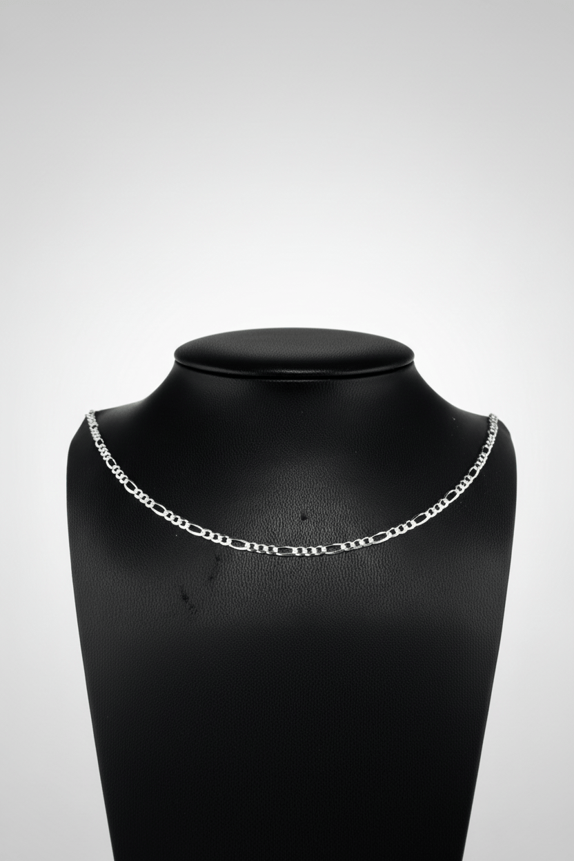 Silver chain necklace on a black mannequin bust