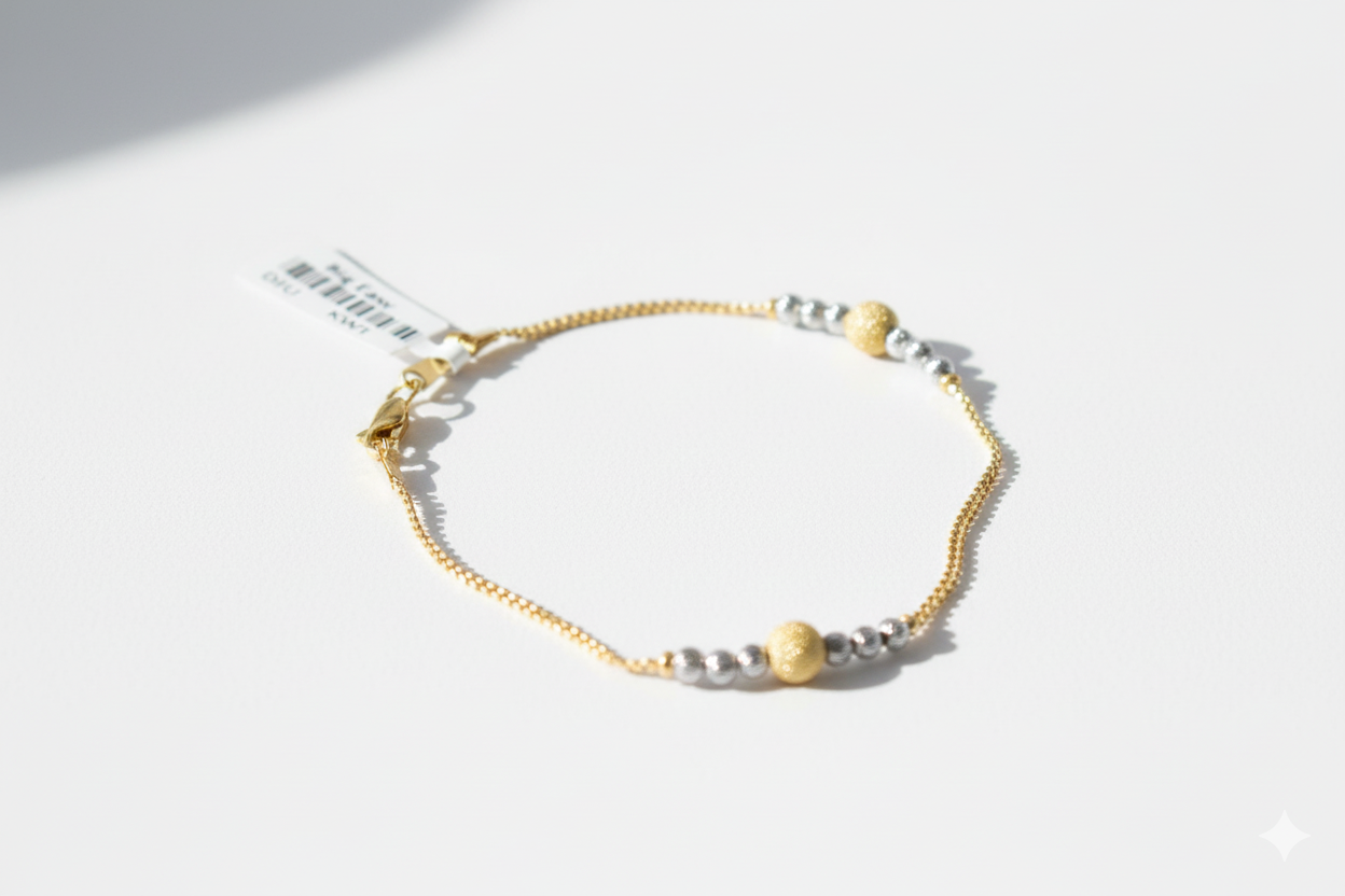 Gold and silver bracelet on a white background