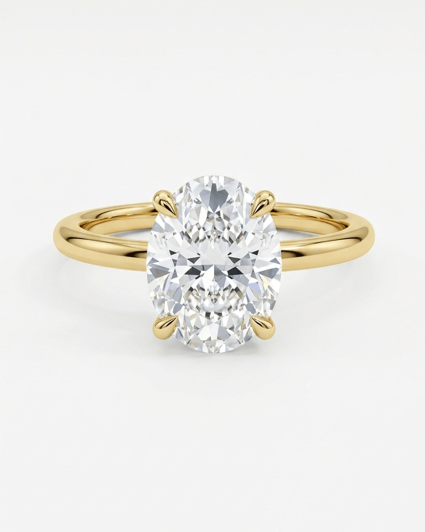Gold ring with a large diamond on a white background
