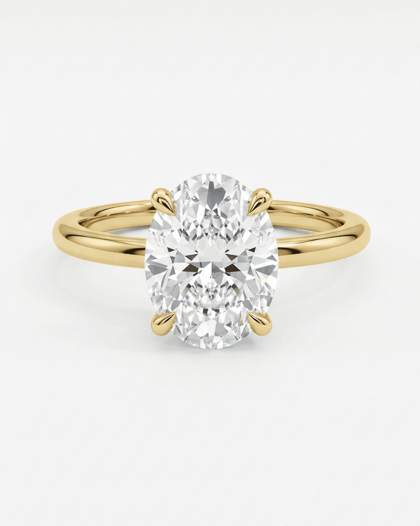 Gold ring with a large diamond on a white background