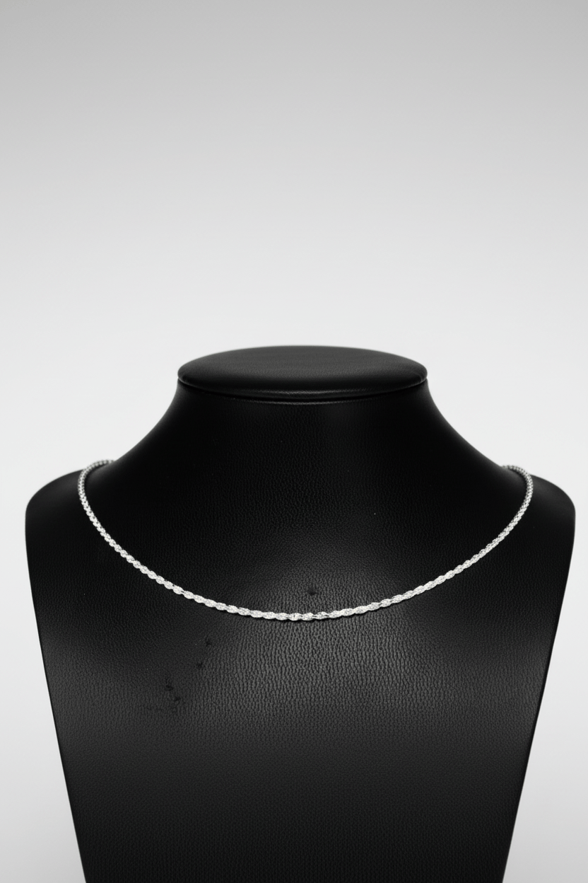 Silver necklace on a black mannequin bust