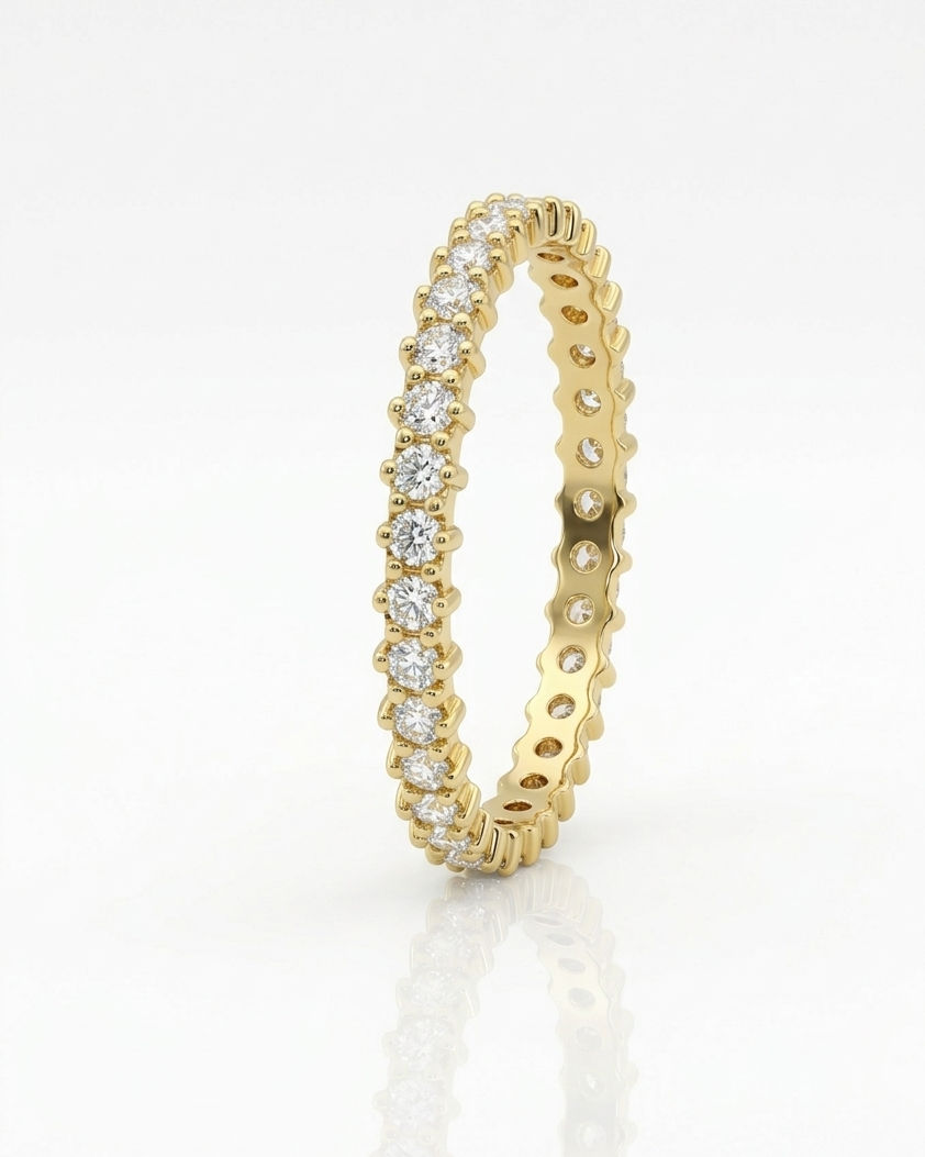 Gold ring with diamond accents on a white background