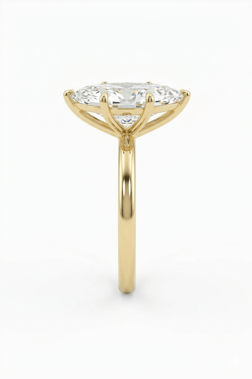 Gold ring with a diamond on a white background