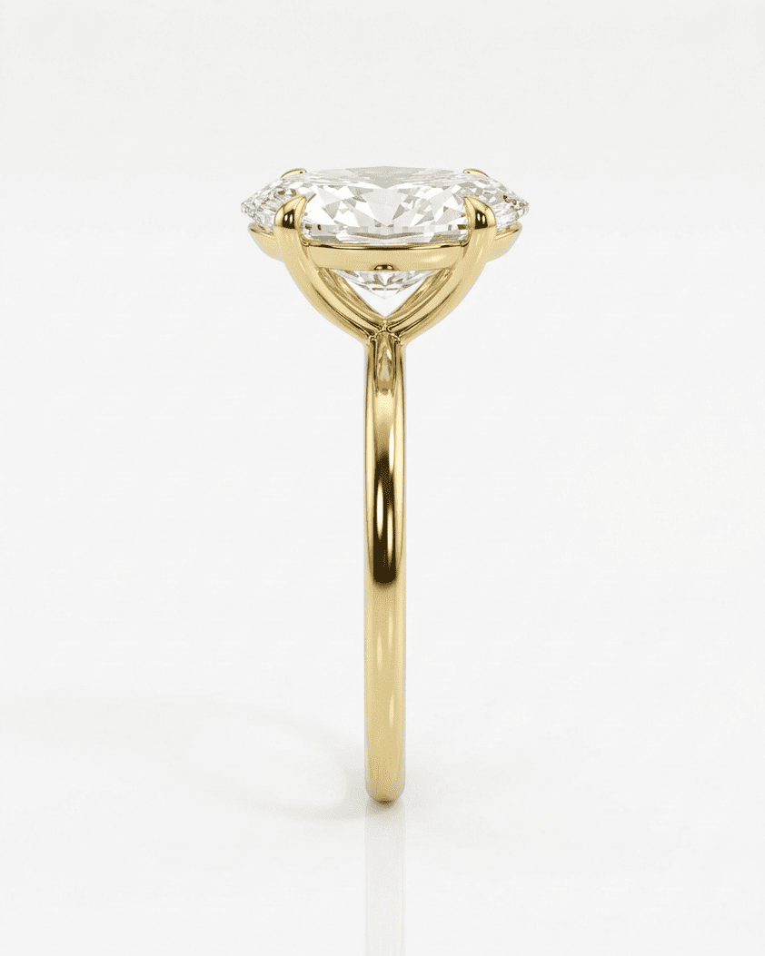Gold ring with a diamond on a white background