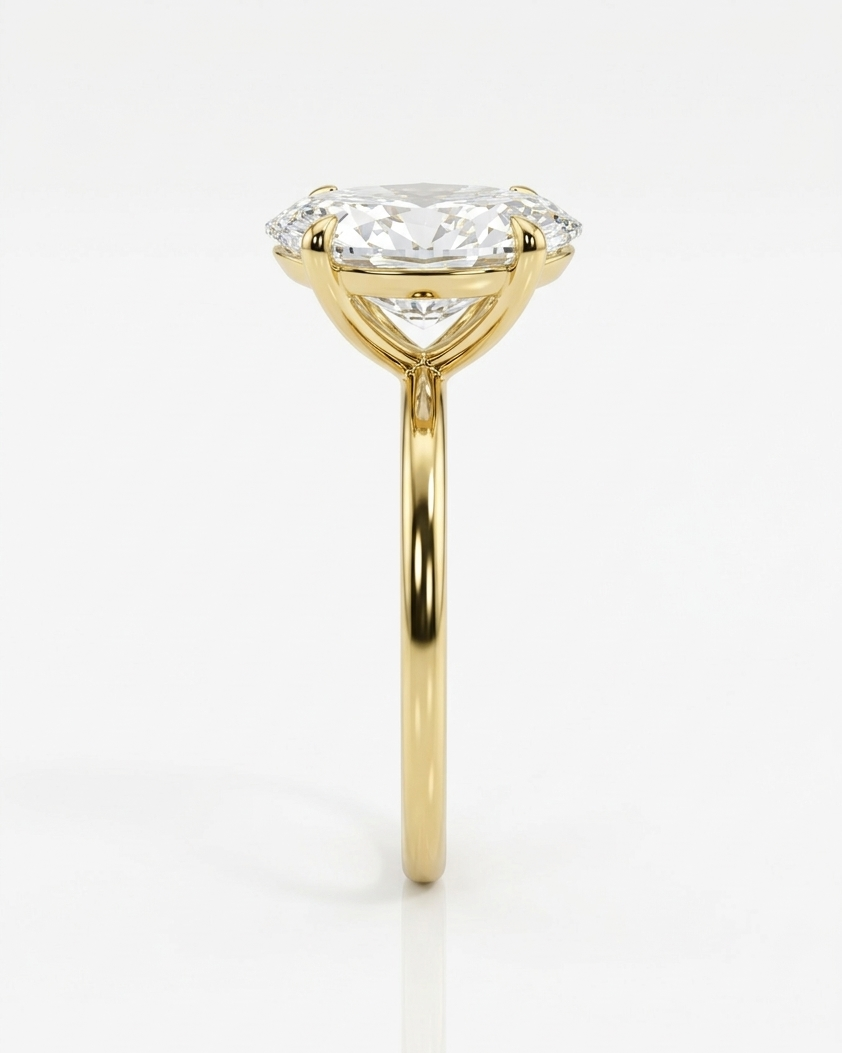 Gold ring with a diamond on a white background