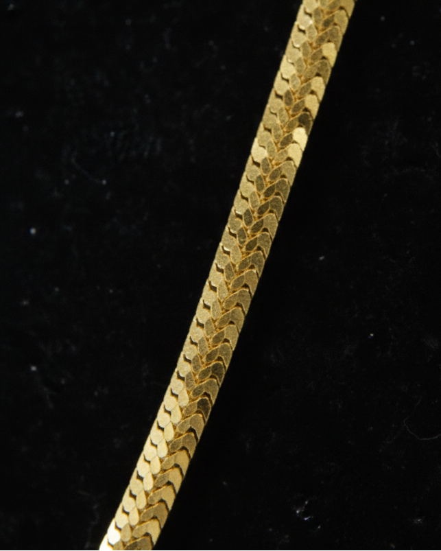 Gold chain on a black background