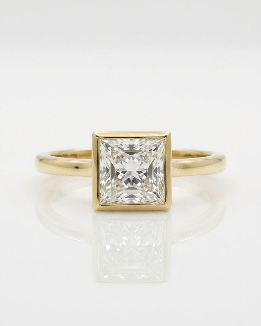 Gold ring with a large diamond on a white background