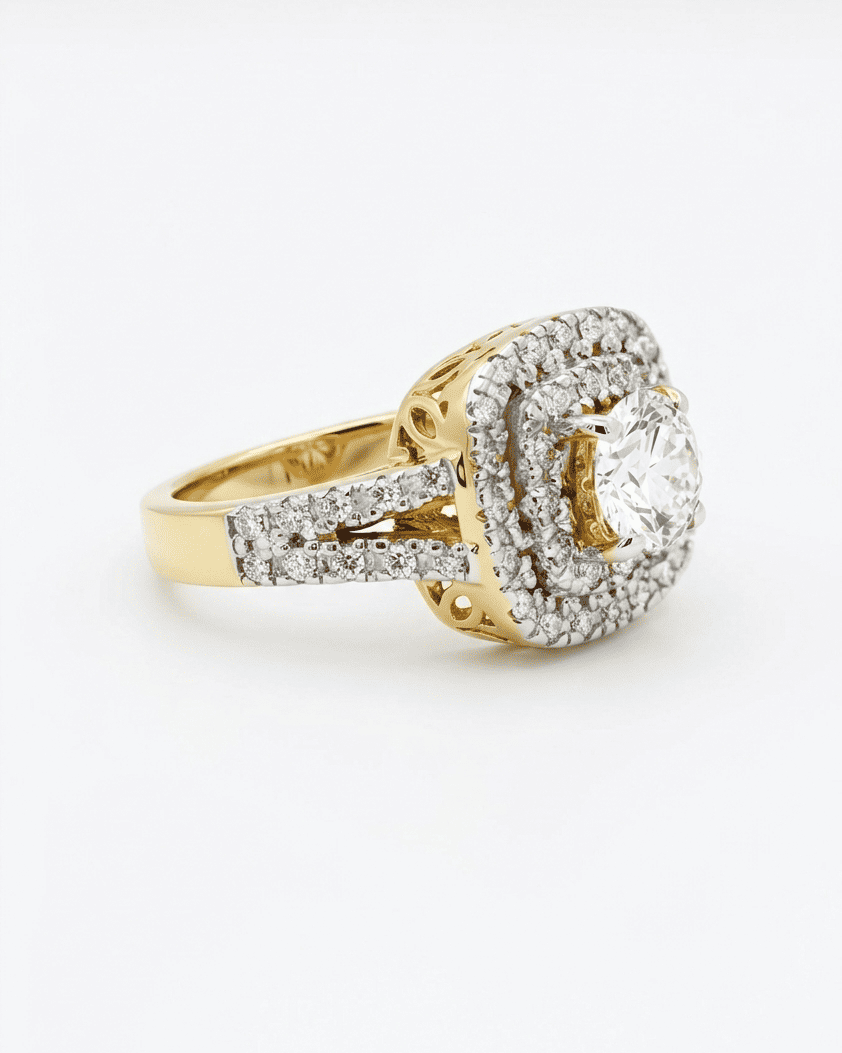 Gold ring with diamond accents on a white background