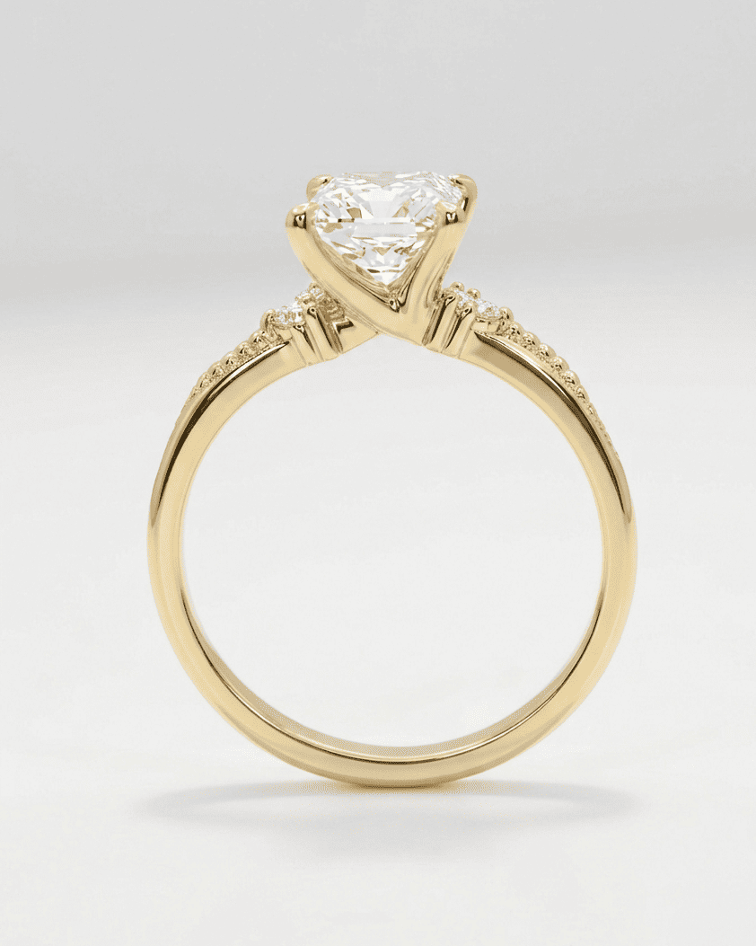 Gold ring with a diamond on a light gray background