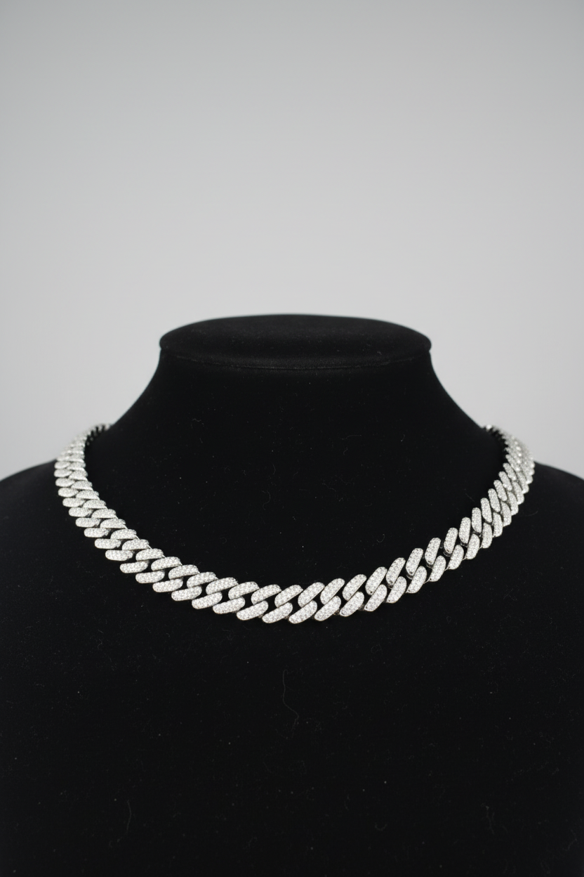 Silver chain necklace on a black mannequin bust