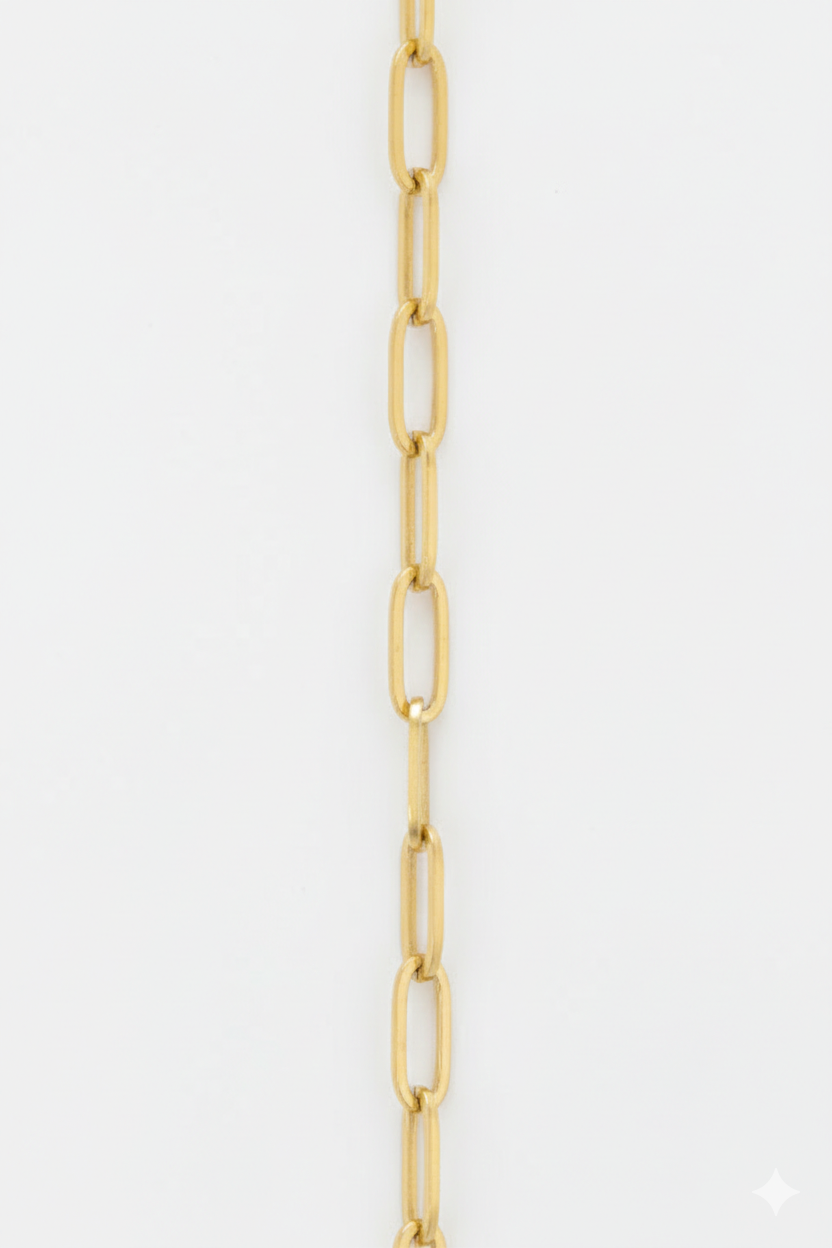 Gold chain on a light gray background