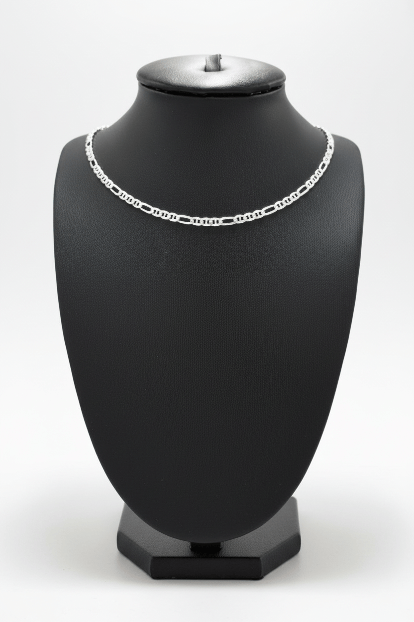 Silver chain necklace on a black mannequin bust