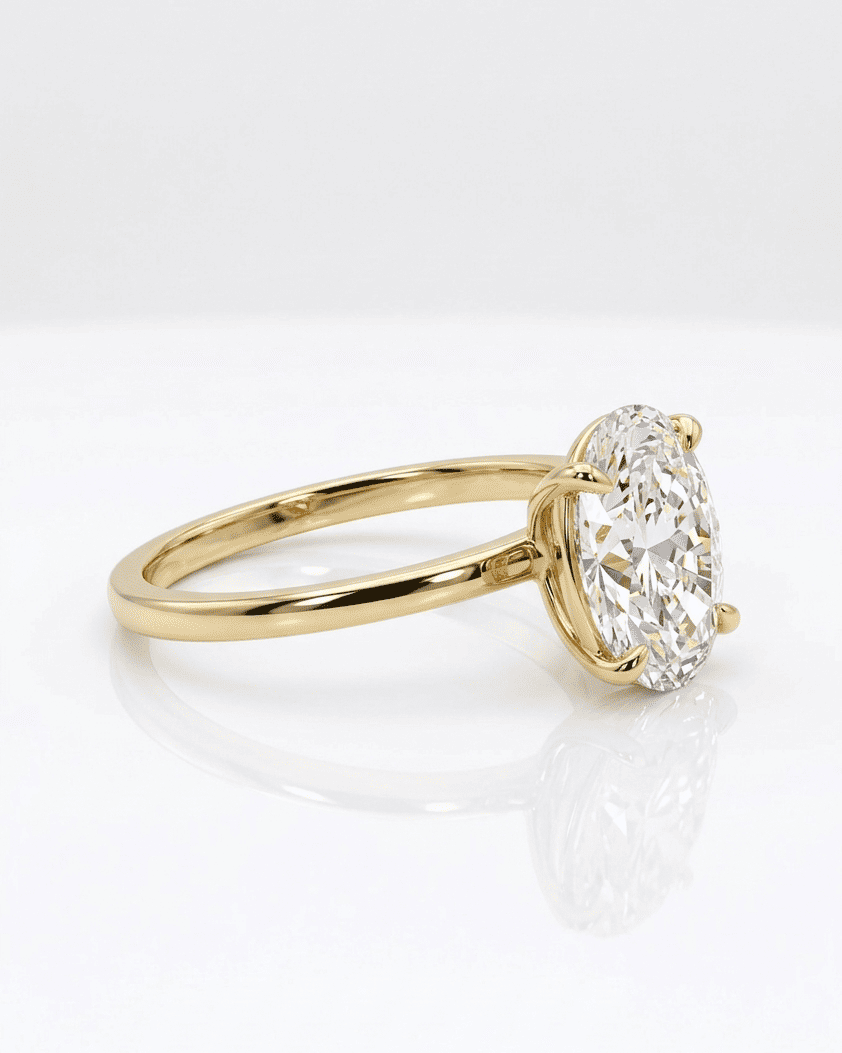 Gold ring with a large diamond on a white background