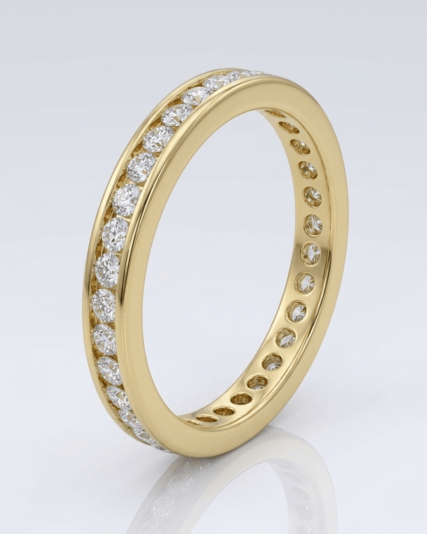 Gold ring with embedded diamonds on a light gray background