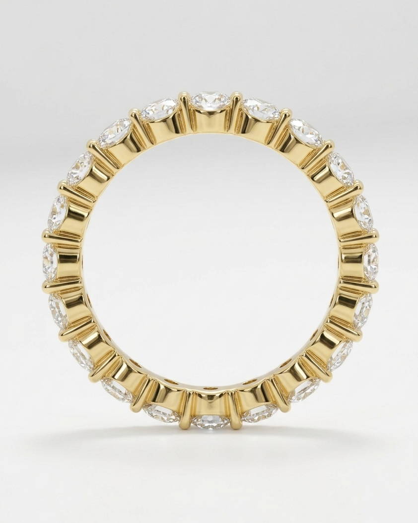 Gold ring with embedded diamonds on a white background