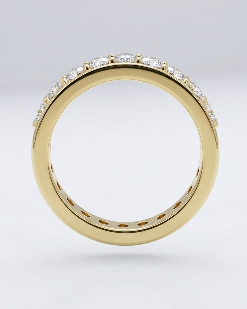 Gold ring with diamonds on a light gray background