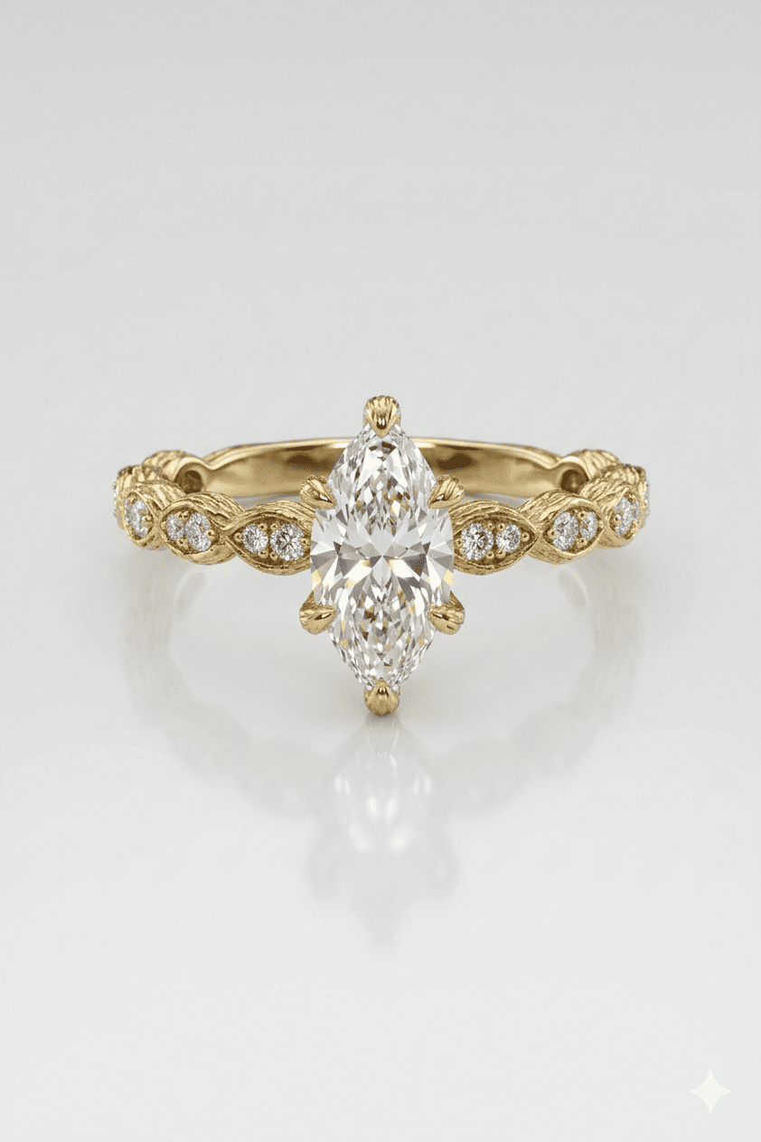Gold ring with a pear-shaped diamond on a light gray background