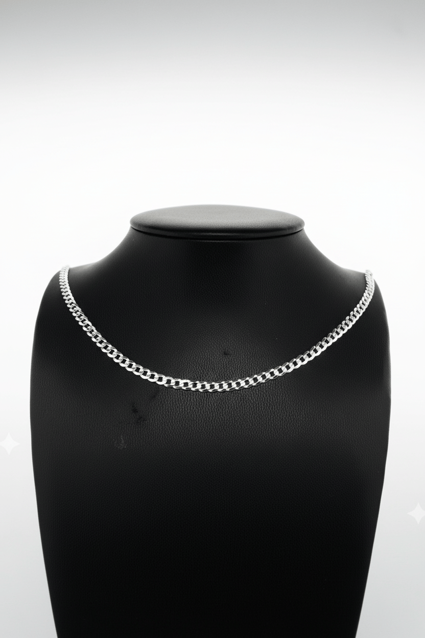 Silver chain necklace on a black mannequin bust against a white background