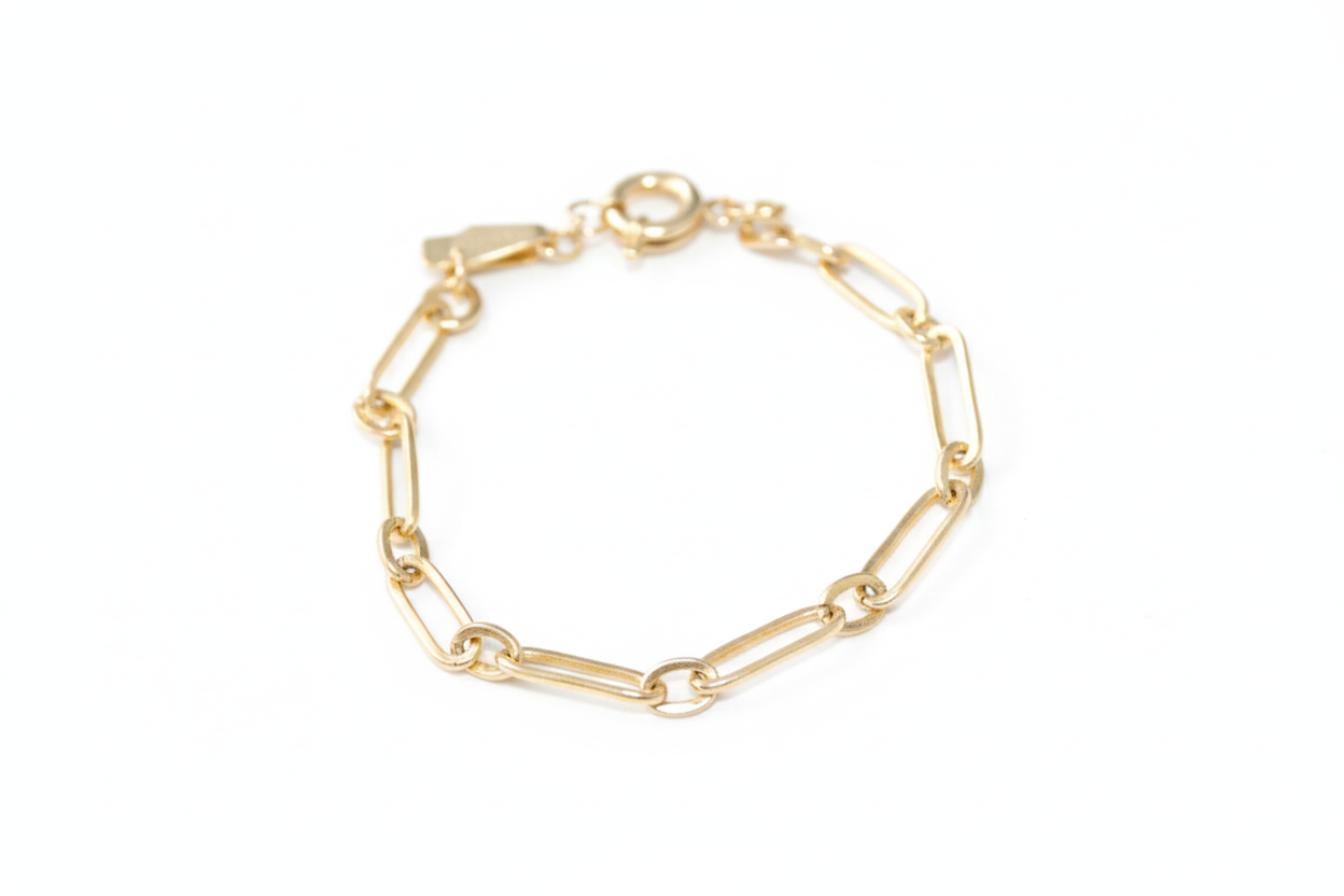 Gold chain bracelet on a white background