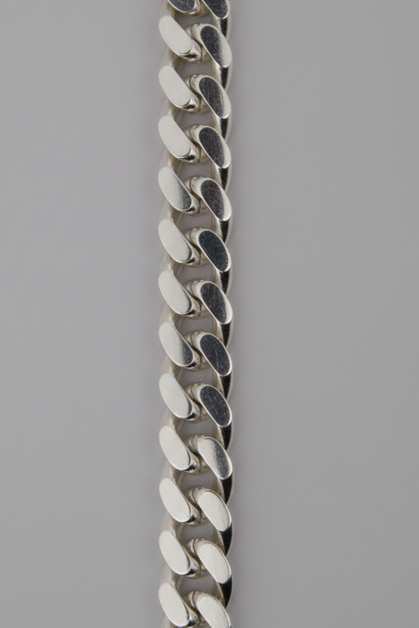 Silver chain bracelet on a gray background