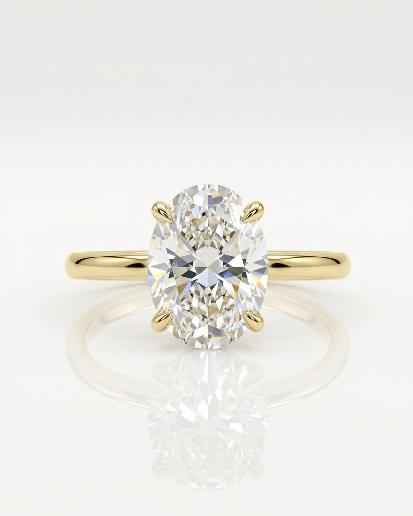 Gold ring with a large diamond on a white background