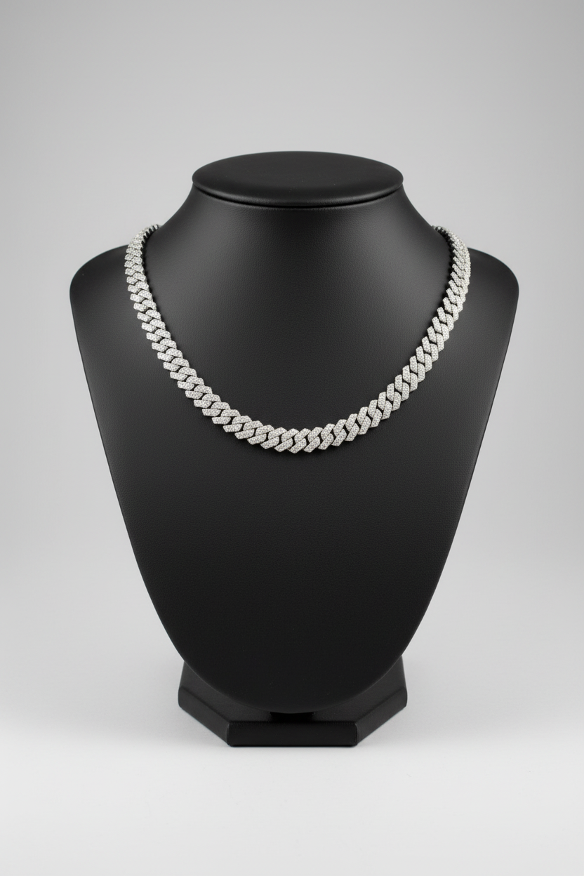 Silver chain necklace on a black mannequin with a white background