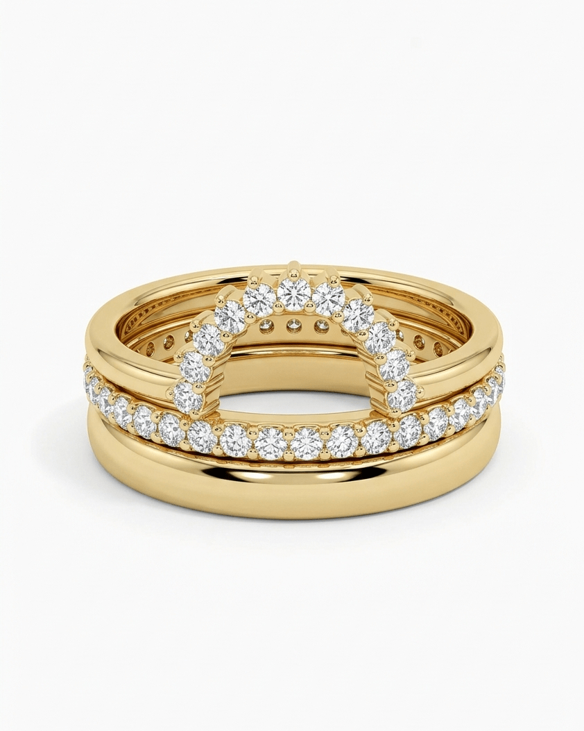 Gold ring with diamond accents on a white background