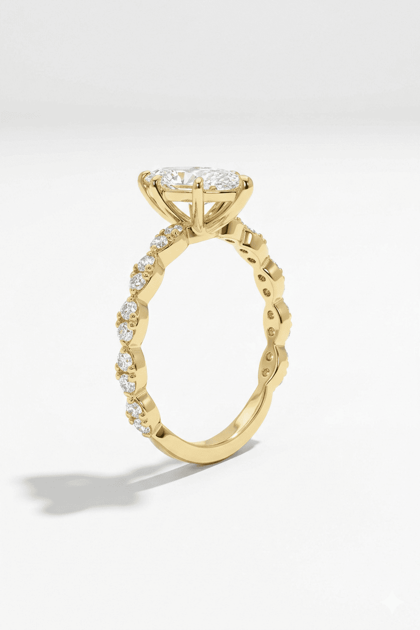 Gold ring with diamond accents on a light gray background
