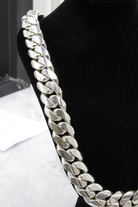 Silver chain belt on a black background