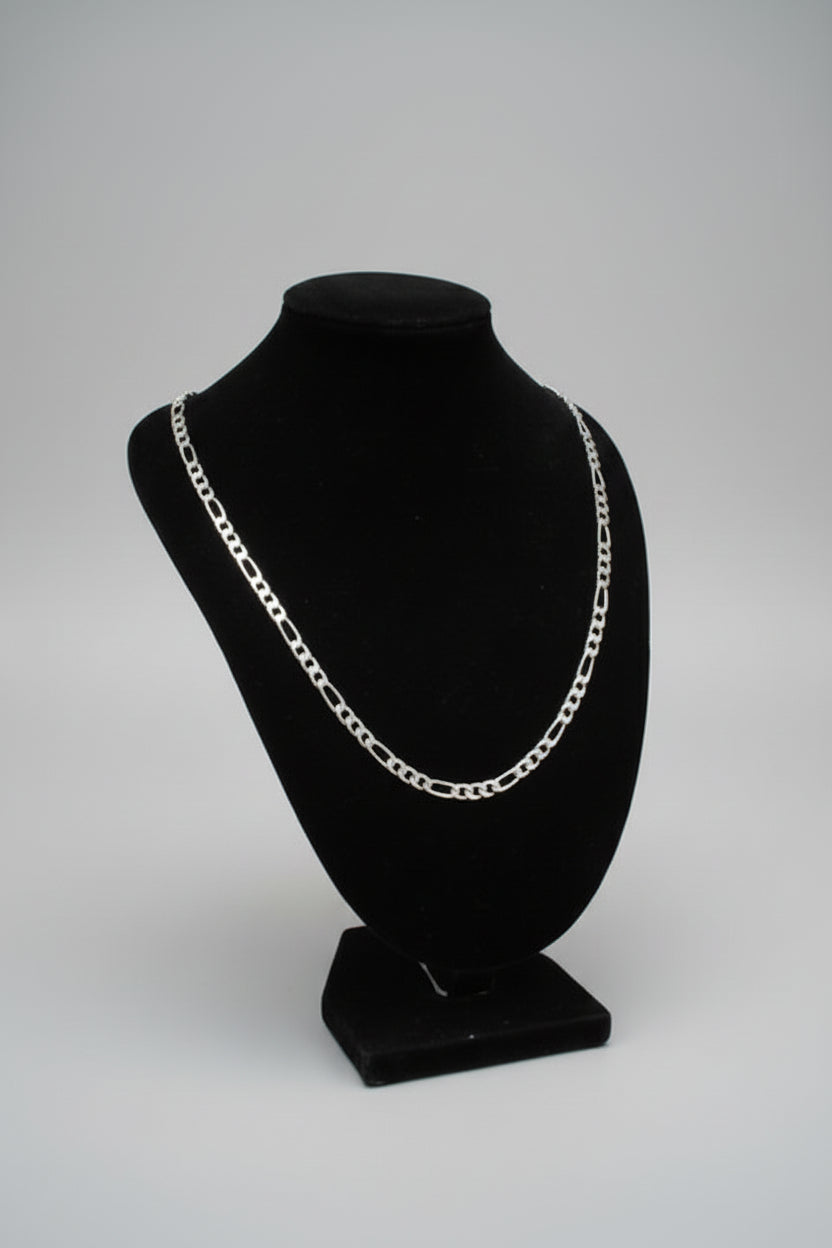 Black belt bag with chain detail on a marble surface