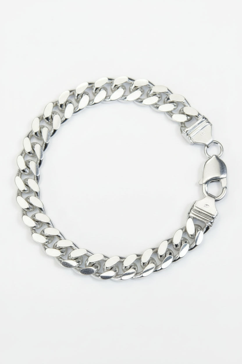 Silver chain bracelet on a gray background