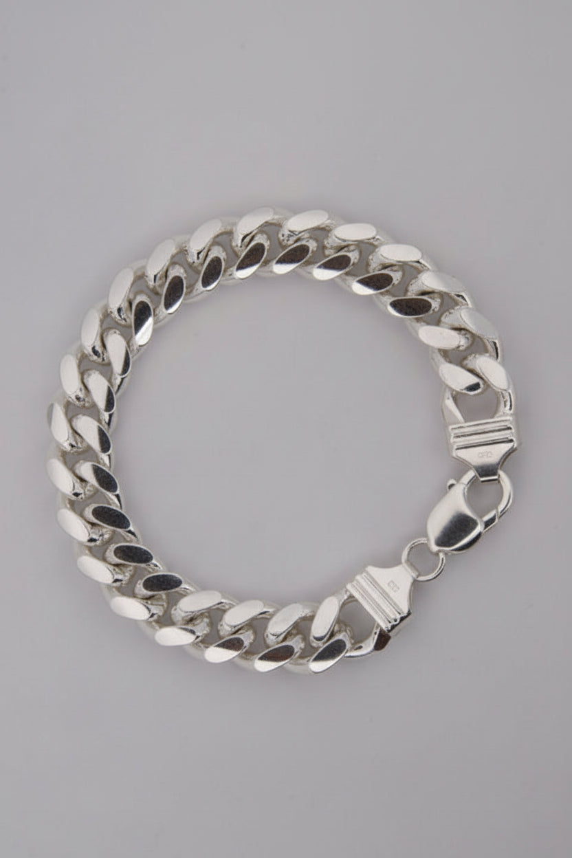 Silver chain bracelet on a gray background
