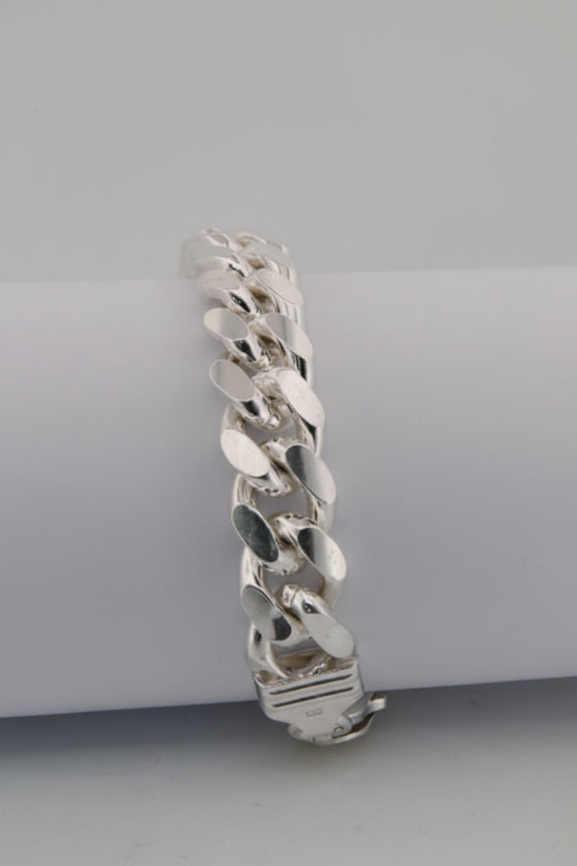 Silver chain bracelet on a light gray background