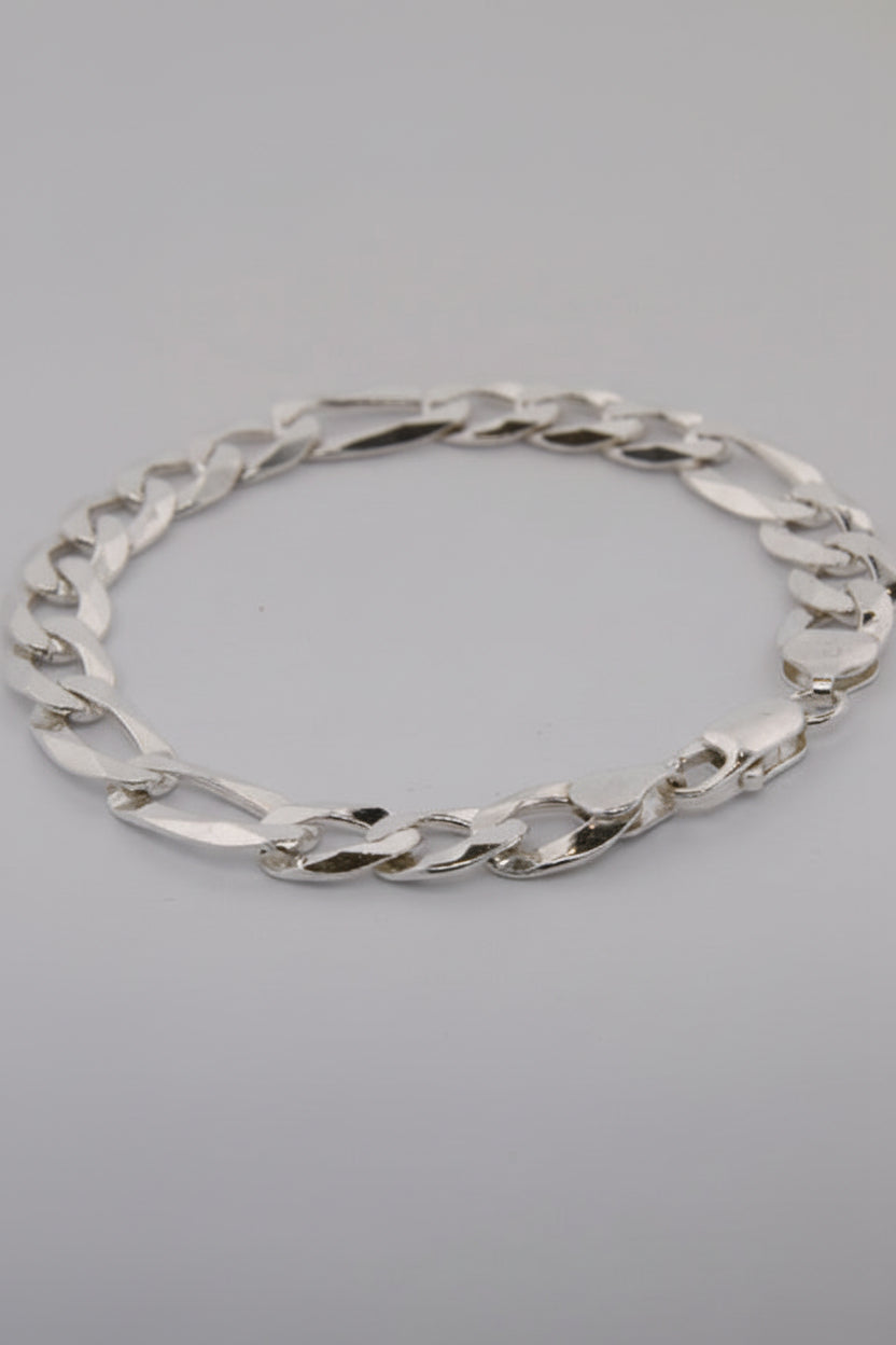 Silver chain necklace on a gray background