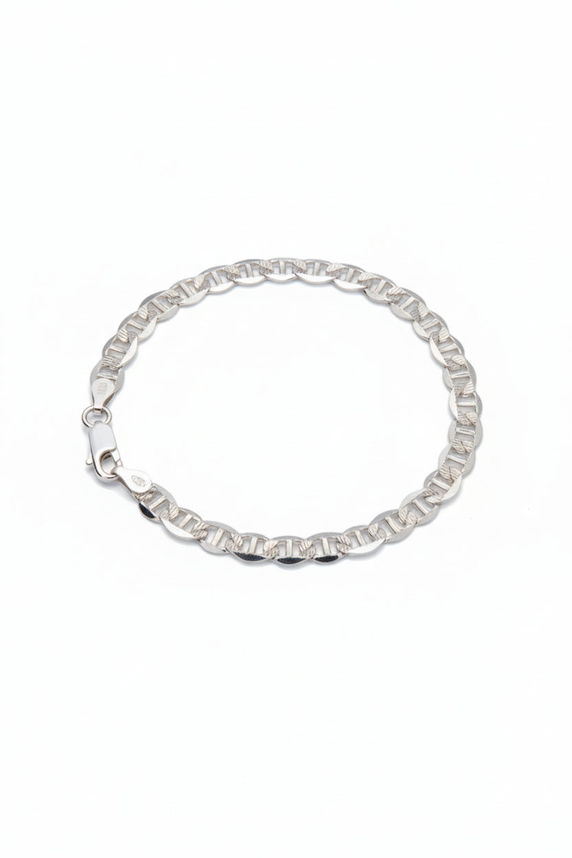 Silver bracelet on a gray background