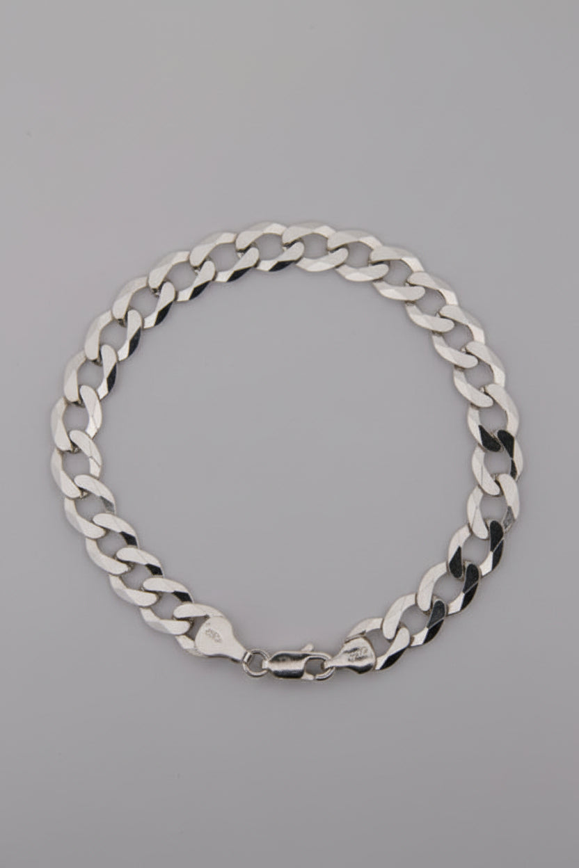 Silver chain bracelet on a gray background