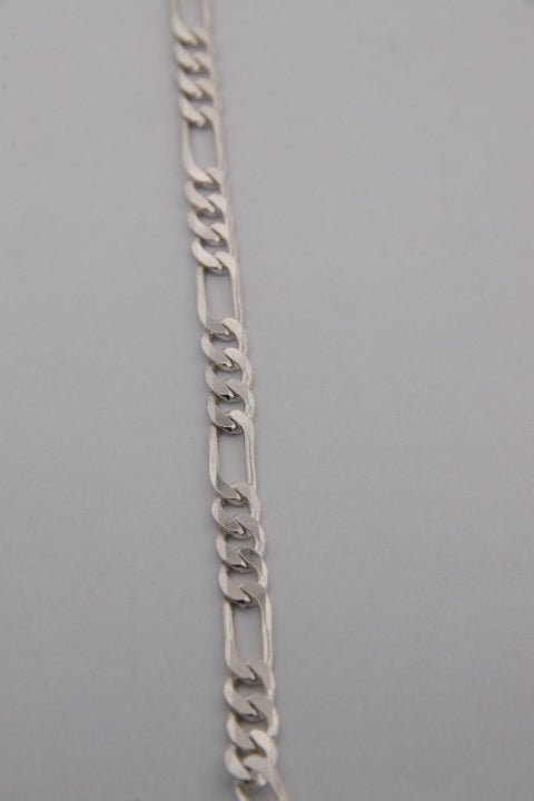 Silver chain on a gray background