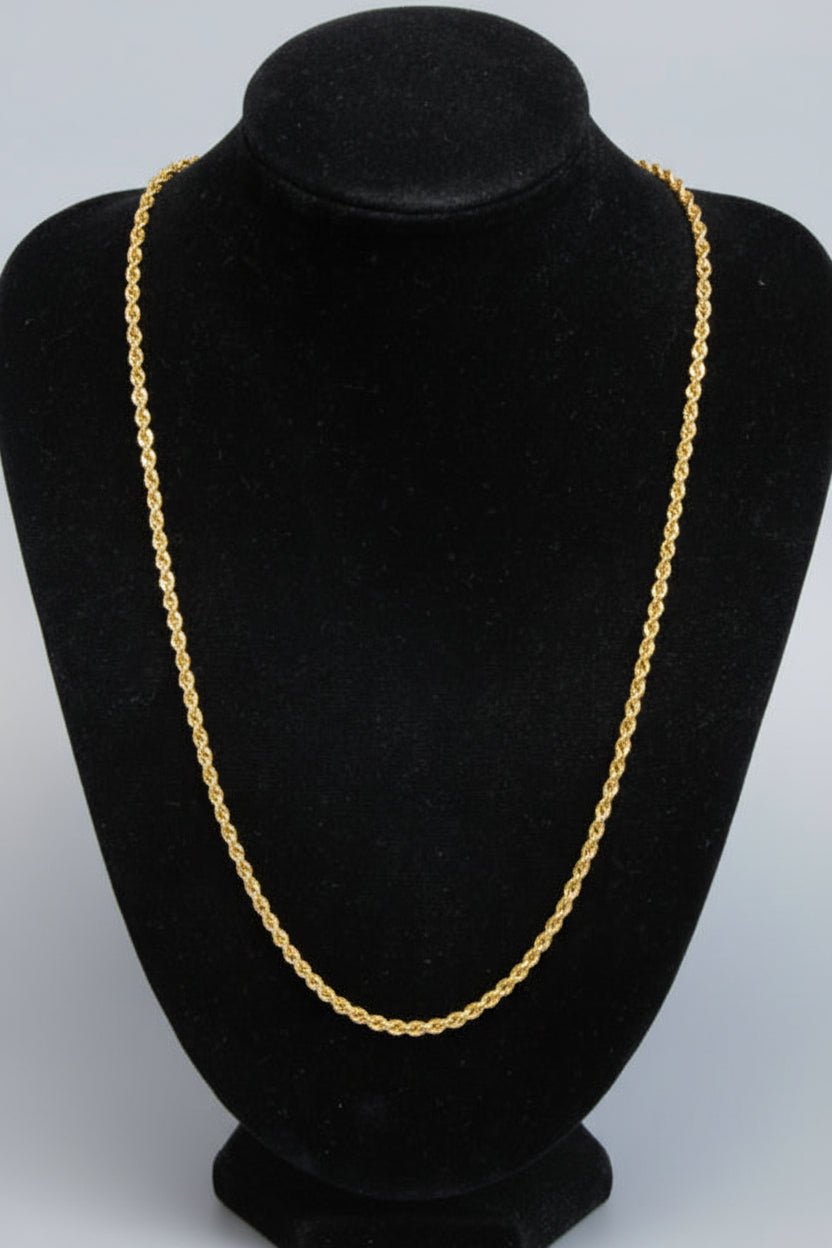 Gold chain on a black background