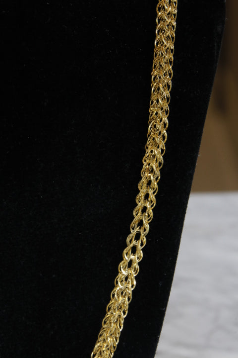 Gold chain on a black background