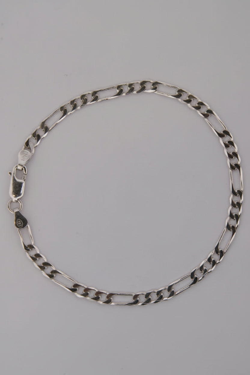 Silver chain bracelet on a gray background