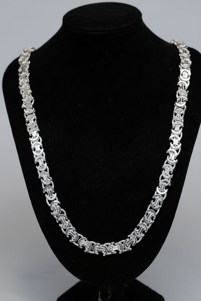 Sterling Silver chain necklace on a black mannequin bust